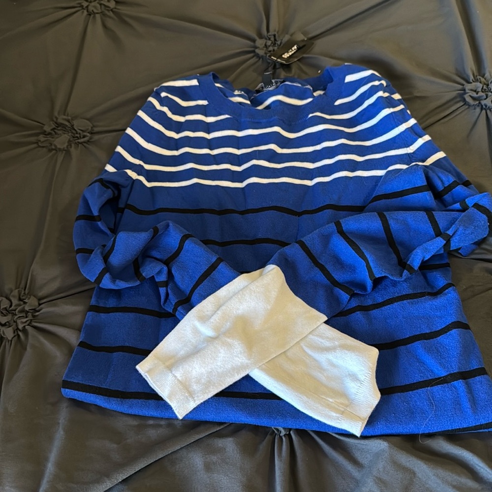 Brand new blue, black and white sweater